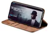 A smartphone in a brown flip case, displaying a movie poster for 'The Inspector'. Produktbild-Vorschau