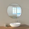 A modern bathroom sink with a round LED mirror reflecting a beach scene. Produktbild-Vorschau