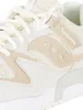 Close-up view of a beige and white Saucony athletic shoe. Produktbild-Vorschau