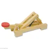 A wooden catapult model with a red projectile. Produktbild-Vorschau