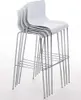 A stack of four white bar stools with chrome legs on a white background. Podgląd zdjęcia produktu