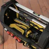 A close-up view of a Stanley FatMax tool bag filled with various tools, including screwdrivers, a level, and a power drill, resting on a wooden floor. Anteprima dell’immagine prodotto