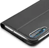 A close-up view of a black flip case for a smartphone, showing the camera cutout. Náhled obrázku produktu
