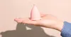 Image of an open hand with a mooncup beginner up side down on it. Produktbild-Vorschau