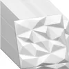 A stack of white 3D wall panels with a geometric, faceted design. Podgląd zdjęcia produktu