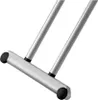 A close-up view of the base of an ironing board with two silver poles and black caps on the ends. Anteprima dell’immagine prodotto