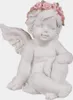 A white cherub figurine with a pink rose wreath on its head sits with its legs crossed. Produktbild-Vorschau