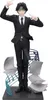 A figurine of a character from Hunter x Hunter in a suit, with musical notes and papers as a base. Produktbild-Vorschau