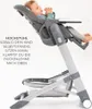 A baby is sitting in a high chair, which is shown in a reclined position. Produktbild-Vorschau