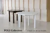 Two round dining tables, one dark brown and one white, are displayed in a room with a textured wall. Produktbild-Vorschau