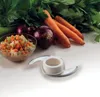 A food processor blade is shown in the foreground with chopped vegetables, red onions, and carrots in the background. Náhľad obrázku produktu