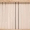 A close-up view of a cream-colored cabinet with vertical slats, framed by a light wood border at the top and bottom. Voir les images du produit