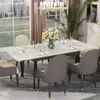 A dining table set in a well-lit room with large windows overlooking a garden. The table is set for a meal with plates, cutlery, and a vase of flowers. Produktbild-Vorschau
