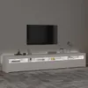 A modern white TV stand with LED lighting, featuring a large flat-screen TV mounted on the wall above it. Produktbild-Vorschau
