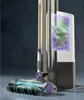 A close-up view of a cordless stick vacuum cleaner, showcasing its dustbin and brush head with a visual representation of dirt being collected. Anteprima dell’immagine prodotto