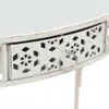 A close-up view of a white metal side table with a decorative drawer front. Produktbild-Vorschau