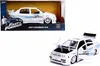 A toy Volkswagen Jetta in its packaging and a separate shot of the toy car with its doors and hood open. Voir les images du produit