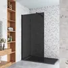 A modern bathroom with a walk-in shower, shelving unit, and decorative elements. Produktbild-Vorschau