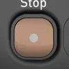 A close-up view of a toaster button. Voir les images du produit
