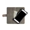 A wallet-style phone case with a phone and cash inside, shown from a top-down perspective. Produktbild-Vorschau