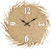 A round straw wall clock with black hands and white numbers on a white background. Podgląd zdjęcia produktu