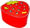 A toy strawberry with small balls and caterpillars on top. Voir les images du produit