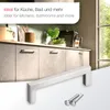 A kitchen cabinet with handles and a close-up of a cabinet handle with screws. Produktbild-Vorschau