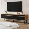 A modern living room setup featuring a TV stand with a television. Produktbild-Vorschau