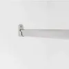 A close-up shot of a closet rod bracket and rod attached to a white wall. Produktbild-Vorschau