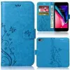 A collage of images showing a blue bookstyle phone case with a floral design, a phone inside the case, and the back of the case. Produktbild-Vorschau