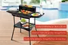 Der Unold 58565 Barbecue-Grill Vario von Unold, abgebildet in Schwarz, mit Gemüse, Würstchen und Ste Produktbild-Vorschau