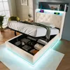 A modern white bed with storage, featuring LED lighting and a tufted headboard, shown with the storage compartment open and filled with items. Náhľad obrázku produktu