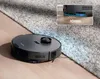 A robot vacuum cleaner is shown on a rug and hardwood floor, with an inset showing a close-up of its height clearance. Produktbild-Vorschau