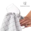 A hand is drying a wine glass with a checkered tea towel. Anteprima dell’immagine prodotto