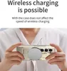 A person is holding a gold foldable phone with a silver wireless charger attached to the back. Náhled obrázku produktu
