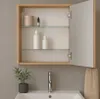 A bathroom cabinet with an open door, showing shelves with toiletries, above a sink and faucet. Produktbild-Vorschau