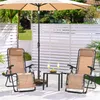 Outdoor patio scene with chairs, umbrella, and table. Produktbild-Vorschau