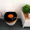 A toilet seat designed to look like a vinyl record player is shown in a bathroom setting. Podgląd zdjęcia produktu