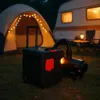 A diesel heater and a portable power station are set up on grass next to a lit tent and a caravan at dusk. Voir les images du produit