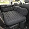 An inflatable mattress is set up in the back of a car, filling the space between the seats. Produktbild-Vorschau