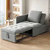 A gray sofa bed is shown in a living room setting. Náhled obrázku produktu
