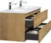A bathroom vanity with a double sink and two faucets, with drawers partially open showing storage. Voir les images du produit