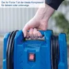 A hand is holding the handle of a blue air compressor. Produktbild-Vorschau