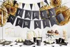 A New Year's Eve party setup with decorations, snacks, and drinks. Podgląd zdjęcia produktu