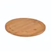 A round wooden cutting board with a groove around the edge, shown from a slightly elevated angle against a white background. Produktbild-Vorschau