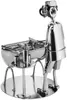 A metallic figurine of a person grilling. Produktbild-Vorschau