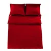 A red bedding set with two pillows is laid out on a white background. Produktbild-Vorschau