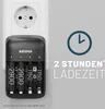 A battery charger plugged into a wall socket, with text indicating charging time. Produktbild-Vorschau