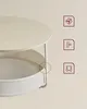 A round coffee table with a built-in fabric basket for storage. Náhled obrázku produktu