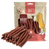 A bag of dog treats with some treats spilled in front. Produktbild-Vorschau